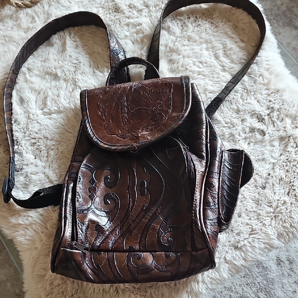Elegant Brown Leather Backpack with Embossed Design